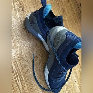 Under Armour shoes by The Rock, men’s size 8.5.